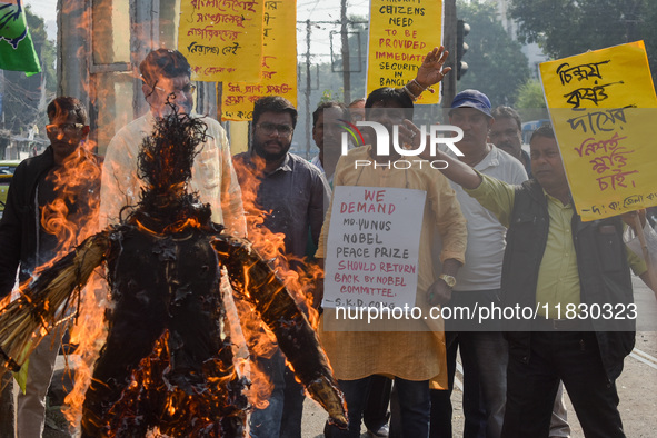 Protestors burn an effigy of Muhammad Yunus during a protest organized by South Kolkata District Congress in Kolkata, India, on December 3,...