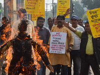 Protestors burn an effigy of Muhammad Yunus during a protest organized by South Kolkata District Congress in Kolkata, India, on December 3,...