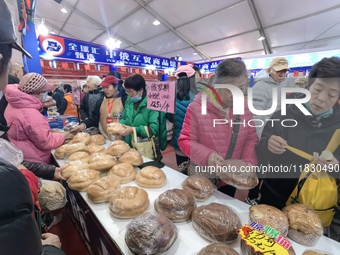 Citizens buy Russian goods at the Wukesong Sino-Russian Mutual Trade Pavilion in Beijing, China, on December 3, 2024. (