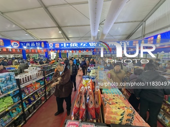 Citizens buy Russian goods at the Wukesong Sino-Russian Mutual Trade Pavilion in Beijing, China, on December 3, 2024. (