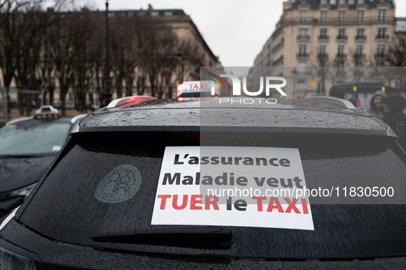 Taxi drivers gather at the Invalides in Paris, France, on December 3, 2024, during a demonstration against a new downward pricing system for...