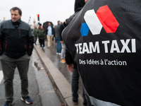 Taxi drivers gather at the Invalides in Paris, France, on December 3, 2024, during a demonstration against a new downward pricing system for...