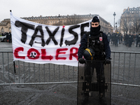 French Republicain Security Corps (CRS) officers face taxi drivers at the Invalides. Taxi drivers gather at the Invalides during a demonstra...