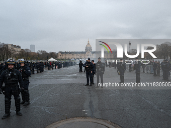 French Republicain Security Corps (CRS) officers face taxi drivers at the Invalides. Taxi drivers gather at the Invalides during a demonstra...