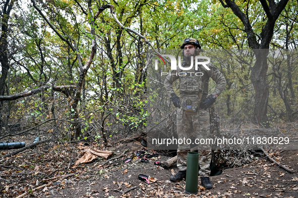 An artilleryman of the Khyzhak Patrol Police Special Unit is on a combat mission at the positions in Donetsk region, eastern Ukraine, on Oct...