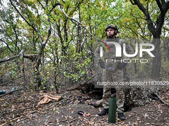 An artilleryman of the Khyzhak Patrol Police Special Unit is on a combat mission at the positions in Donetsk region, eastern Ukraine, on Oct...