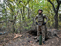 An artilleryman of the Khyzhak Patrol Police Special Unit is on a combat mission at the positions in Donetsk region, eastern Ukraine, on Oct...