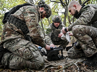 Artillerymen of the Khyzhak Patrol Police Special Unit are on a combat mission at the positions in Donetsk region, eastern Ukraine, on Octob...