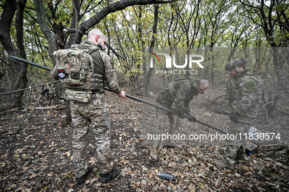 Artillerymen of the Khyzhak Patrol Police Special Unit are on a combat mission at the positions in Donetsk region, eastern Ukraine, on Octob...