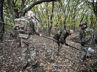 Artillerymen of the Khyzhak Patrol Police Special Unit are on a combat mission at the positions in Donetsk region, eastern Ukraine, on Octob...