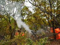 In Donetsk region, Ukraine, on October 25, 2024, the artillerymen of the Khyzhak Patrol Police Special Unit fire a howitzer at the positions...