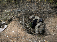 An artilleryman of the Khyzhak Patrol Police Special Unit is on a combat mission at the positions in Donetsk region, eastern Ukraine, on Oct...