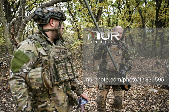 Artillerymen of the Khyzhak Patrol Police Special Unit are on a combat mission at the positions in Donetsk region, eastern Ukraine, on Octob...