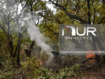 In Donetsk region, Ukraine, on October 25, 2024, the artillerymen of the Khyzhak Patrol Police Special Unit fire a howitzer at the positions...