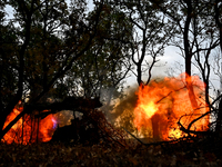 In Donetsk region, Ukraine, on October 25, 2024, the artillerymen of the Khyzhak Patrol Police Special Unit fire a howitzer at the positions...