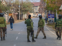 Indian security personnel are near the site of a gun battle between militants and security forces on the outskirts of Srinagar, Jammu and Ka...