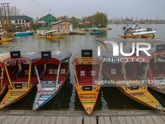 Uber signs are displayed on ''Shikaras'' or small boats after Uber launches its first water transport service on the waters of Dal Lake, in...