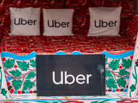 Uber signs are displayed on ''Shikaras'' or small boats after Uber launches its first water transport service on the waters of Dal Lake, in...