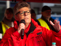 Henrike Eickholt, head of the state department of NRW, speaks during the rally at Harmonie Square in Rheydt, Germany, on December 3, 2024, d...