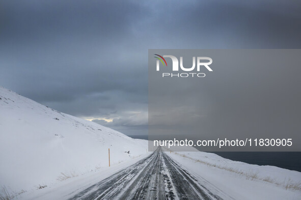 The scenario of alternate road 82 on the way to the town of Olafsfjordur in Iceland on November 27, 2024, shows that roads in northern Icela...