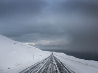 The scenario of alternate road 82 on the way to the town of Olafsfjordur in Iceland on November 27, 2024, shows that roads in northern Icela...