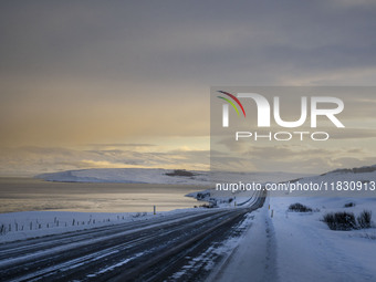 The alternate road 82, along the coast on the way to the town of Hjalteyri, Iceland, on November 27, 2024, presents unique challenges due to...