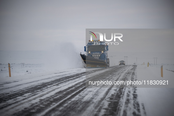 A snow plow vehicle clears Route 1 (Ring Road) on the way to the city of Akureyri, Iceland, on November 27, 2024. Roads in northern Iceland...