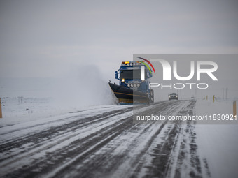 A snow plow vehicle clears Route 1 (Ring Road) on the way to the city of Akureyri, Iceland, on November 27, 2024. Roads in northern Iceland...