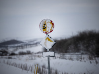 A traffic sign is partially covered by snow on Route 1 (Ring Road) on the way to the town of Blonduos in Iceland on November 27, 2024. Roads...