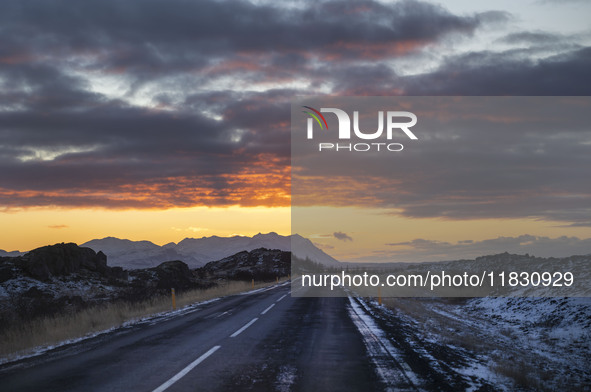 Sunset occurs on the alternate road 555 in the region of Kleppjarnsreykir, Iceland, on November 27, 2024. Roads in northern Iceland present...