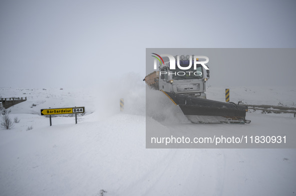 A snow plow vehicle clears Route 1 (Ring Road) on the way to the city of Akureyri, Iceland, on November 27, 2024. Roads in northern Iceland...