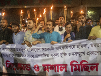 Protesters hold a torchlight procession on the Dhaka University campus in Dhaka, Bangladesh, on December 3, 2024. The demonstration protests...