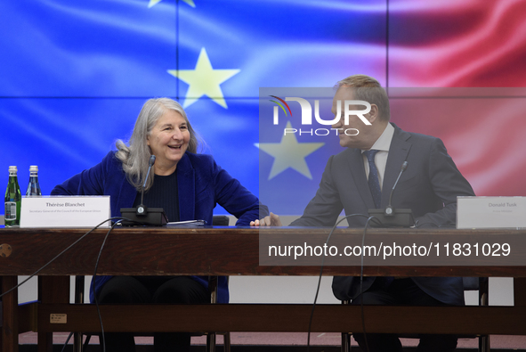 Polish Prime Minister Donald Tusk and Secretary-General of the Council of the European Union Therese Blanchet participate in a meeting with...