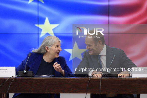 Polish Prime Minister Donald Tusk and Secretary-General of the Council of the European Union Therese Blanchet participate in a meeting with...