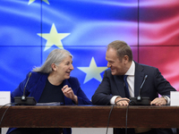 Polish Prime Minister Donald Tusk and Secretary-General of the Council of the European Union Therese Blanchet participate in a meeting with...