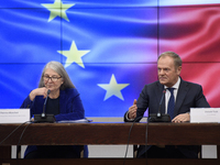 Polish Prime Minister Donald Tusk and Secretary-General of the Council of the European Union Therese Blanchet participate in a meeting with...