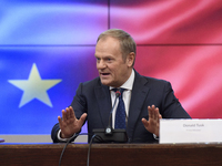 Polish Prime Minister Donald Tusk gestures as he speaks during a meeting with the Secretary-General of the Council of the European Union (EU...