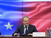 Polish Prime Minister Donald Tusk gestures as he speaks during a meeting with the Secretary-General of the Council of the European Union (EU...