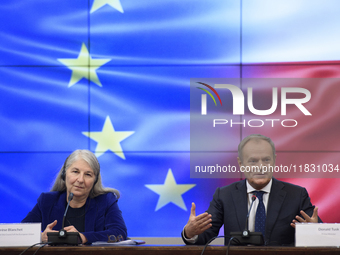 Polish Prime Minister Donald Tusk and Secretary-General of the Council of the European Union Therese Blanchet participate in a meeting with...