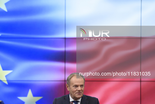 Polish Prime Minister Donald Tusk gestures as he speaks during a meeting with the Secretary-General of the Council of the European Union (EU...