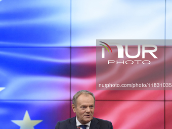 Polish Prime Minister Donald Tusk gestures as he speaks during a meeting with the Secretary-General of the Council of the European Union (EU...