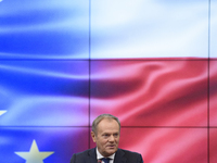 Polish Prime Minister Donald Tusk gestures as he speaks during a meeting with the Secretary-General of the Council of the European Union (EU...