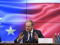 Polish Prime Minister Donald Tusk gestures as he speaks during a meeting with the Secretary-General of the Council of the European Union (EU...