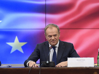 Polish Prime Minister Donald Tusk gestures as he speaks during a meeting with the Secretary-General of the Council of the European Union (EU...