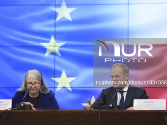 Polish Prime Minister Donald Tusk and Secretary-General of the Council of the European Union Therese Blanchet participate in a meeting with...