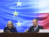 Polish Prime Minister Donald Tusk and Secretary-General of the Council of the European Union Therese Blanchet participate in a meeting with...