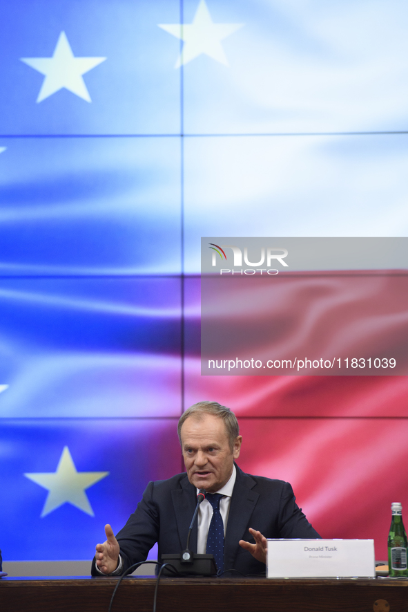 Polish Prime Minister Donald Tusk gestures as he speaks during a meeting with the Secretary-General of the Council of the European Union (EU...