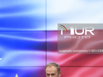 Polish Prime Minister Donald Tusk gestures as he speaks during a meeting with the Secretary-General of the Council of the European Union (EU...