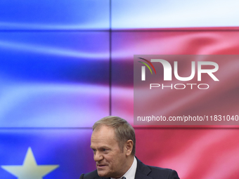 Polish Prime Minister Donald Tusk gestures as he speaks during a meeting with the Secretary-General of the Council of the European Union (EU...