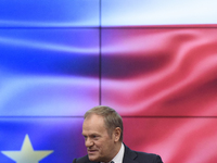 Polish Prime Minister Donald Tusk gestures as he speaks during a meeting with the Secretary-General of the Council of the European Union (EU...